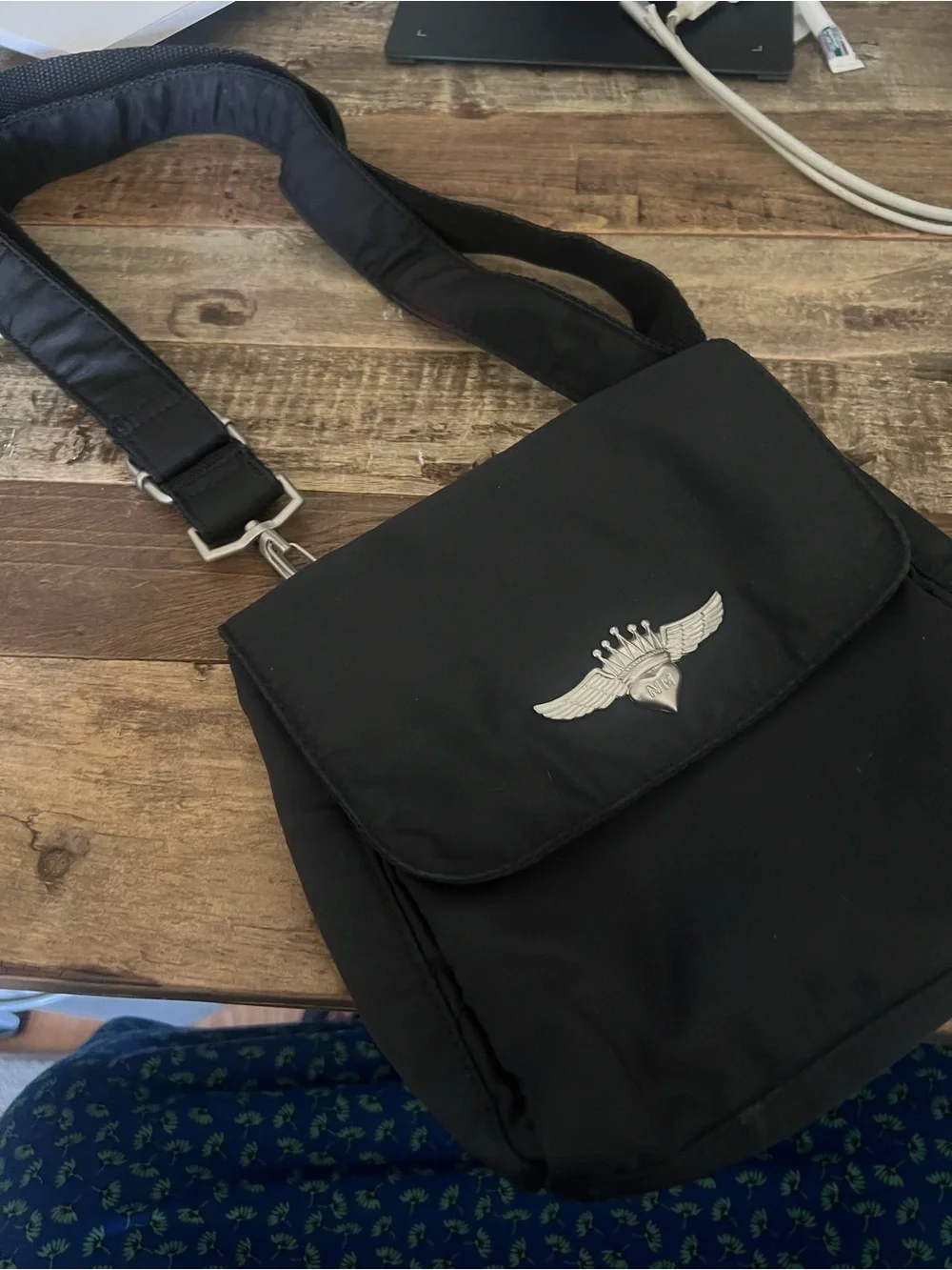 Black Crossbody Shoulder Bag with Winged Emblem by Nicole Miller
